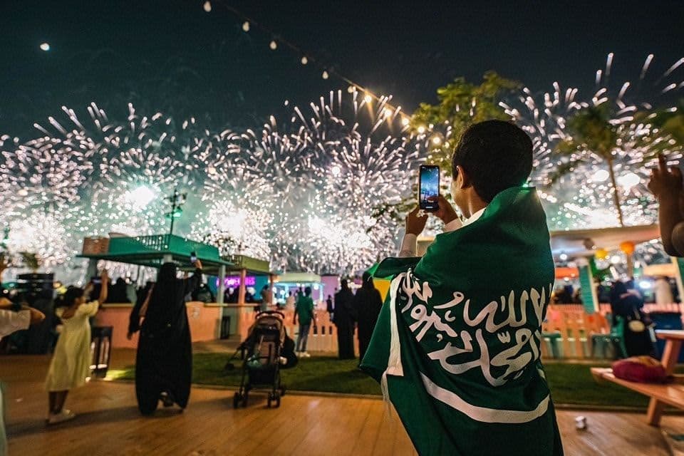 Night event with fireworks and crowd, celebration atmosphere