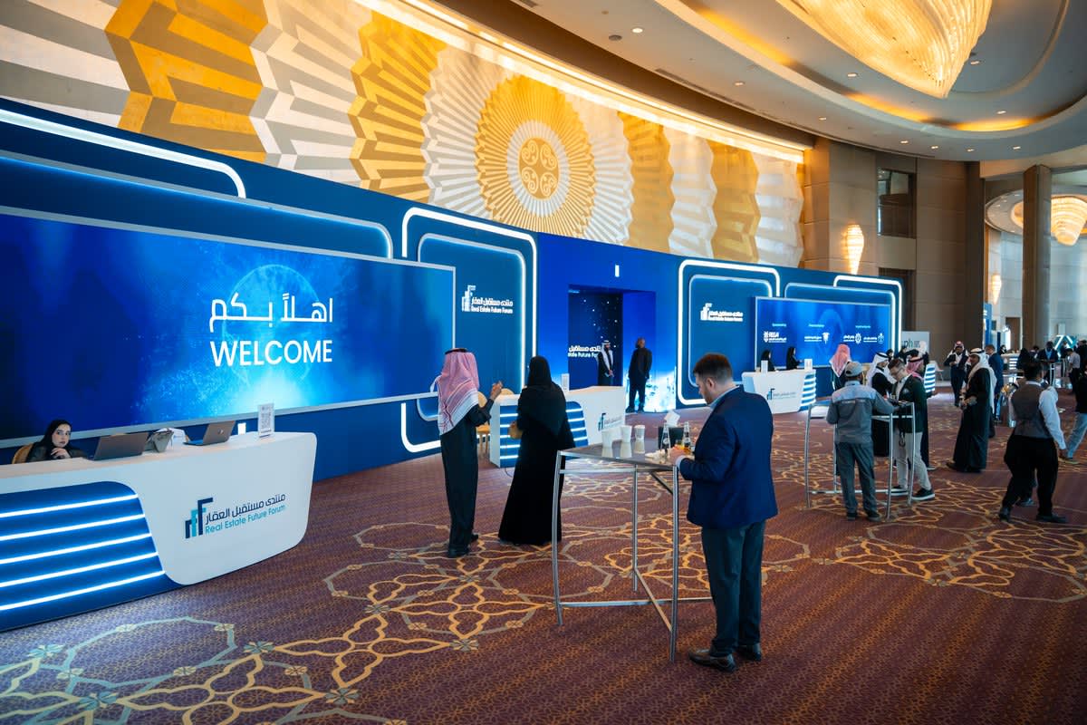 Future Real Estate Forum — branded forum pavilion entrance, illuminated event gateway, and main conference hall