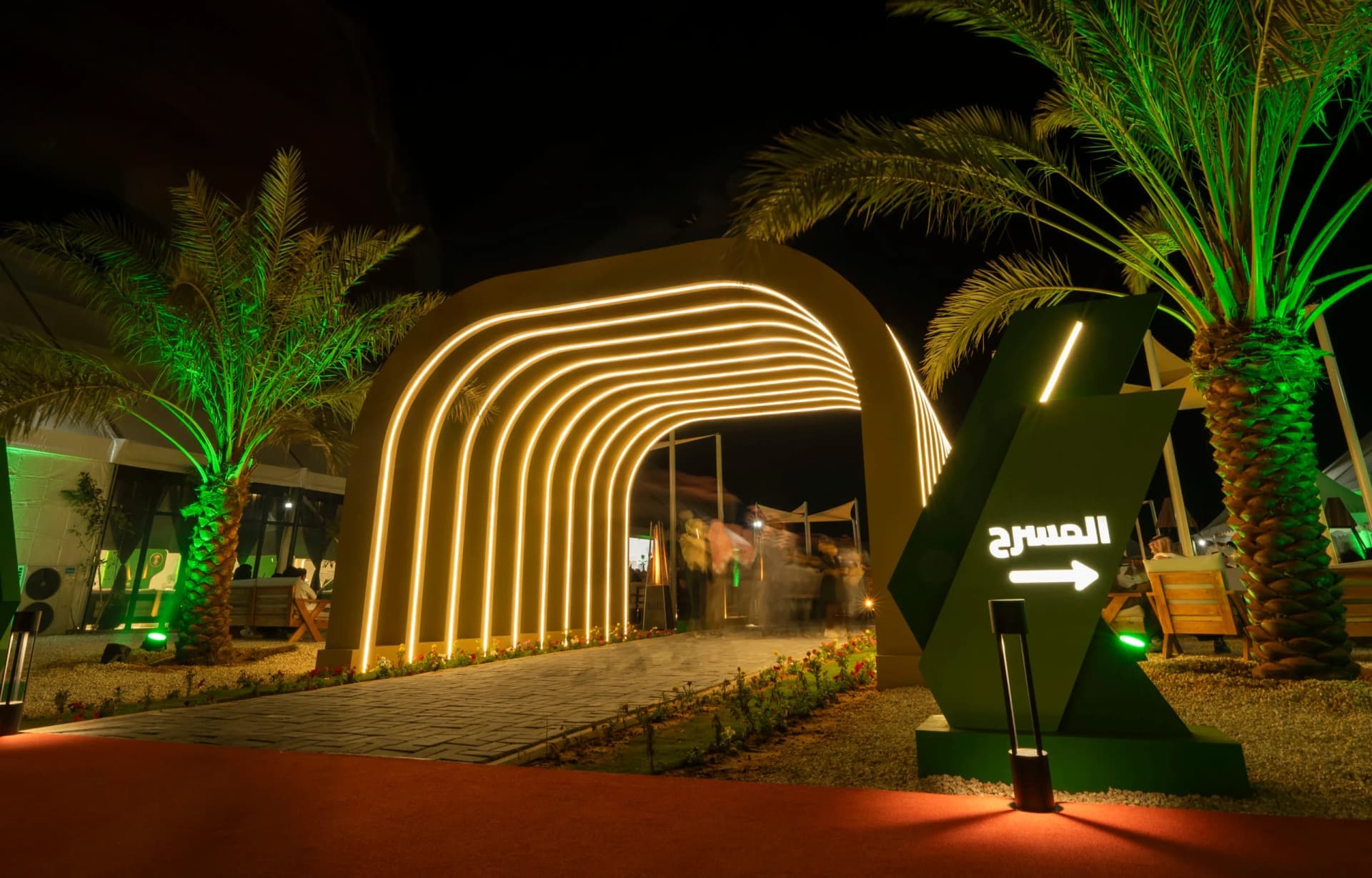 Agricultural Village Festival — welcome desk with ministry branding, outdoor entrance arches and signage, wooden stage walkway