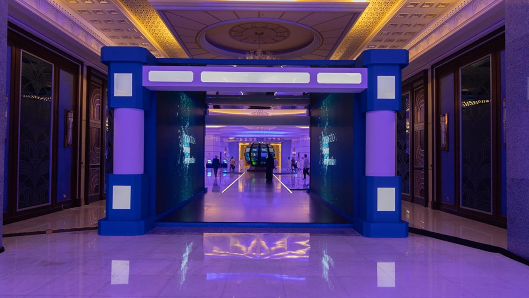 Global Innovation Award Conference — illuminated entrance, award ceremony on stage, and spherical LED installation in the main hall